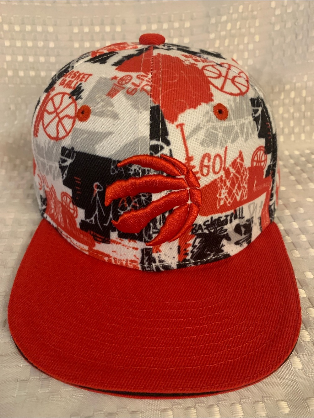 Toronto Raptors youth red, white and black SnapBack hat.